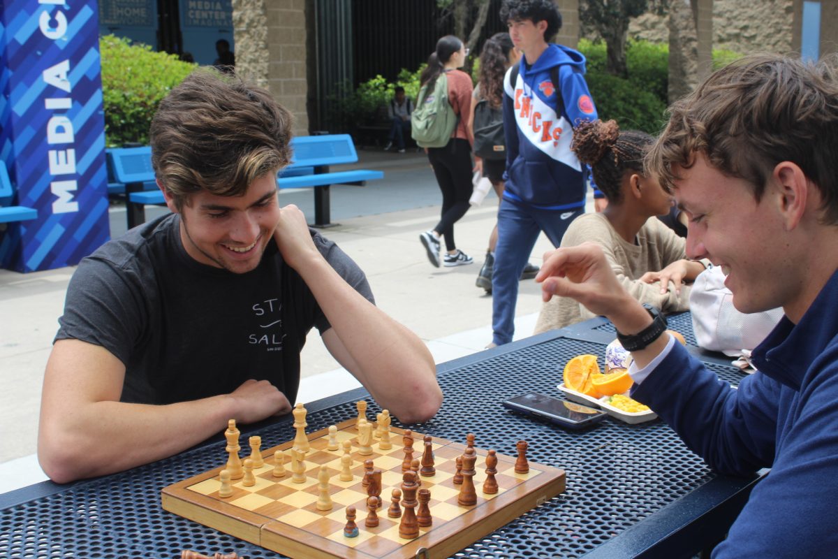 Valedictorian+Alexander+Radulescu+plays+chess+in+the+quad+with+his+friend+at+lunch.