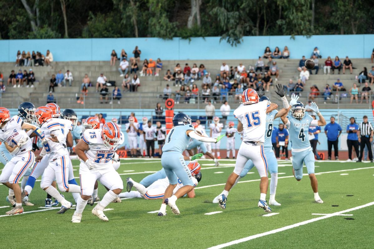 Seniors Xavier Quntanar, Emmanuel Wecheyi, and Matthew Bresko scramble for the ball.