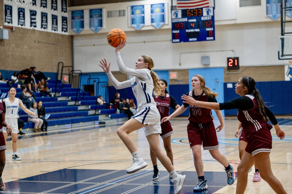 Junior Corurtlyn Mitchell makes a basket against Kearny High at their first game of the season.